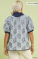 Light blue embroidered shirt with navy collar