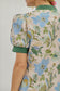 Ecru floral dress with green contrast band