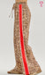 Trending leopard pants with red accented binding