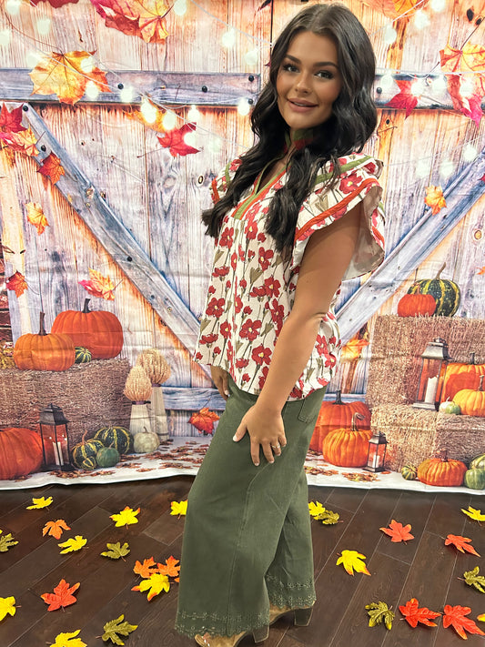 Olive pants with embroidered hem