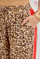 Trending leopard pants with red accented binding